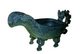A yi (Chinese: 匜; pinyin: yí) is a shape used in ancient Chinese ritual bronzes. It has the shape of half a gourd with a handle (often in the shape of a dragon) and usually supported by four legs. It is believed it was used to contain water for washing hands before rituals like sacrifices.